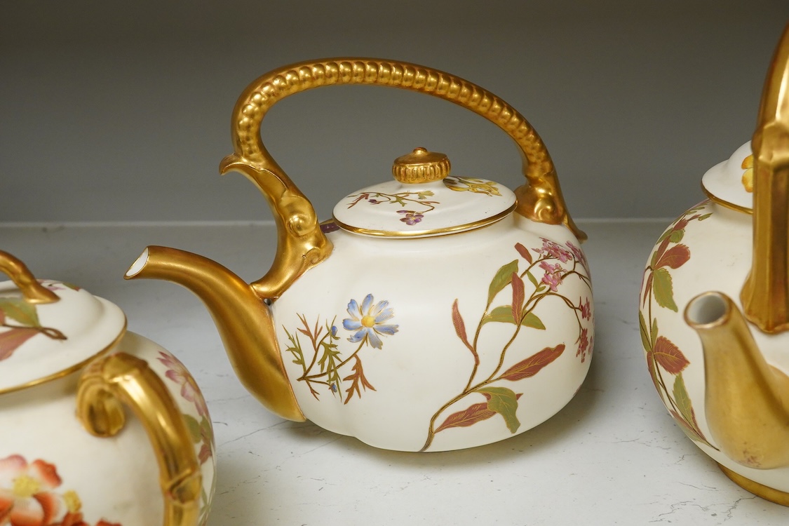 Four 19th century Worcester blush ivory teapots, with floral decoration and decorative handles, largest 20cm wide